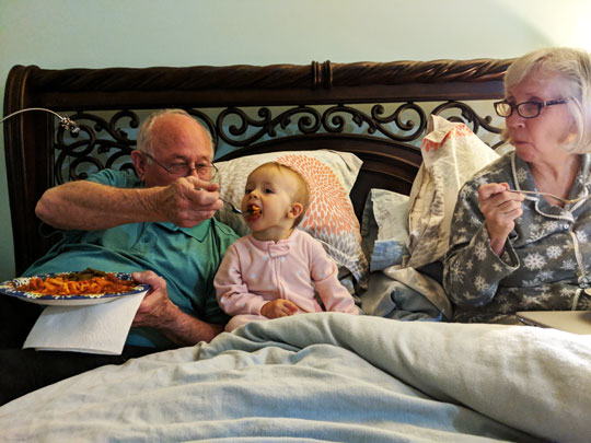 Helmut and Lark Bambl Feed Lily in bed